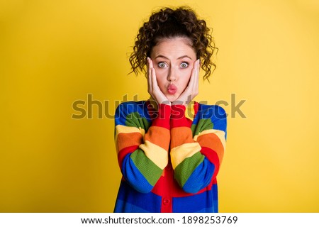 Adorable lady arms cheekbones send air kisses shy hide rose cheeks wear rainbow pullover isolated yellow color background
