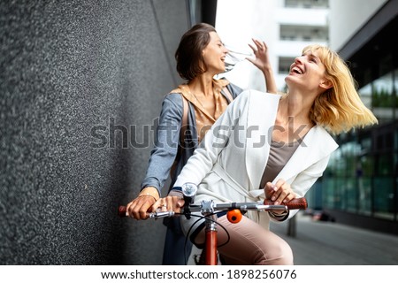 Young happy tourists women sightseeing in city on vacation