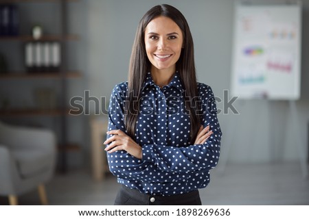 Photo of happy joyful confident young woman wear formalwear folded hands indoors in office workplace workstation