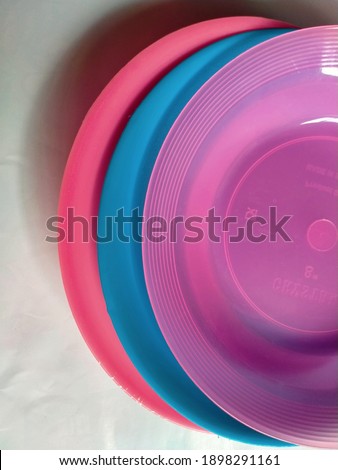 Piles of colorful plates look interesting