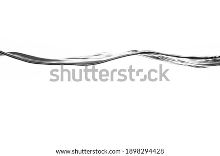 Drinking water splash with bubbles of air, isolated on the white background. Giving a clear and clean feeling movement of the waves