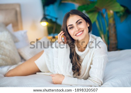 Feeling great. Young beautiful woman smiling and feeling awesome