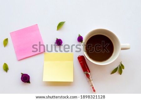 hot coffee with post it note for business work arrangement flat lay style on background white