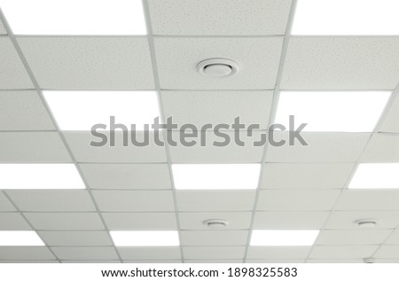 White ceiling with lighting in office room Royalty-Free Stock Photo #1898325583