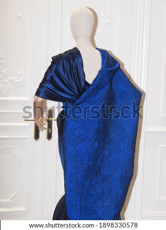 Stylish elegant luxury dark blue evening dress on a mannequin