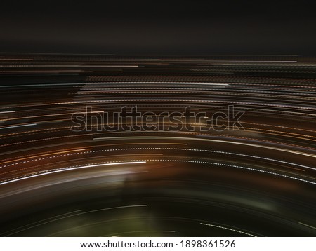 Blurred motion lines on night drone photo. Abstract monohrome background. Natural process. Light. Movement of camera. Dark wallpaper with abstract ornament.  