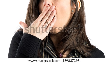 Young girl yawning over isolated white background 