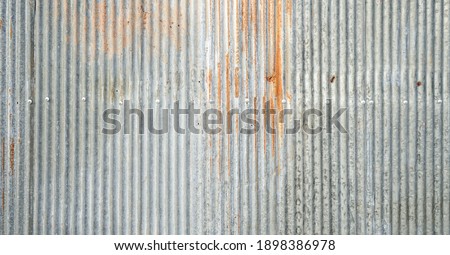 Old galvanized sheet wall with rust background Royalty-Free Stock Photo #1898386978