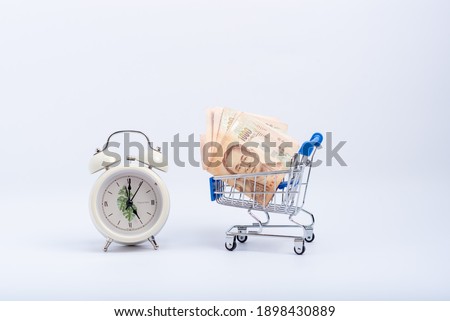 Thai banknotes are empty on the cart And there is a clock telling the time next to it  an investment idea with time
