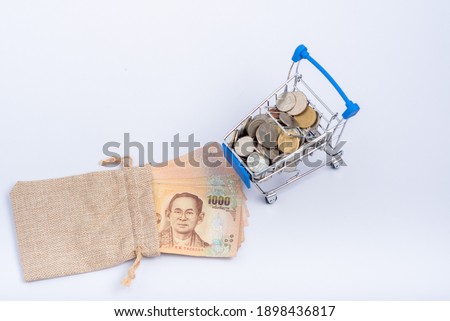 Many stack of Thai baht money in sack bag isolate on white background use for saving money result concept