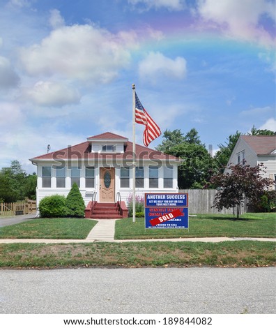 American Flag Pole Sold Real Estate Sign (Another Success Let us Help you Buy Sell your next home) suburban bungalow style home residential neighborhood USA blue sky clouds