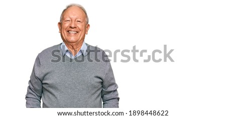 Senior caucasian man wearing casual clothes looking positive and happy standing and smiling with a confident smile showing teeth  Royalty-Free Stock Photo #1898448622