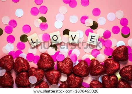 card for valentine's day. on a pink background wooden letters lined with love. funny congratulations. Flat lay, top view