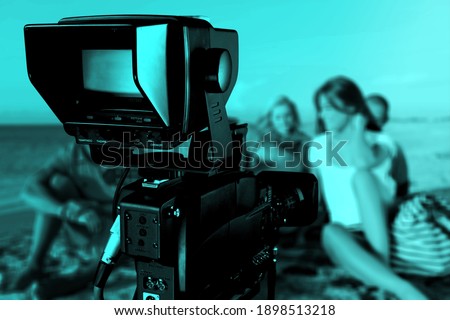Behind the scenes of video recording or filming online movie with digital camera and professional monitor