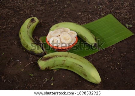 the rest of the green banana on the ground