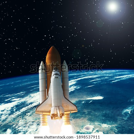 Rocket above the earth. Stars. Space concept. The elements of this image furnished by NASA.

