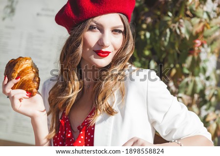 Beautiful woman at the caffeteria. Closeup portrait of attractive blond female outdoors