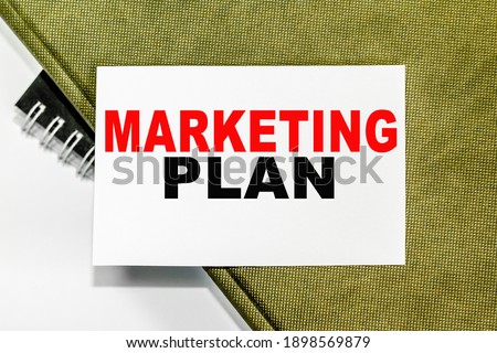 MARKETING PLAN. Office workplace with supplies and reports . SELECTIVE FOCUS. You can use in business, marketing and other concepts. Messege of the day.