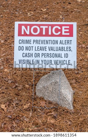 Crime Prevention yard sign in park