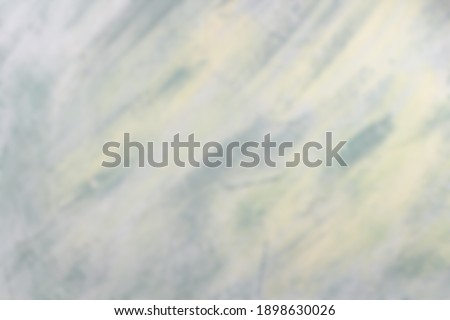 Blurred abstract background in late summer or early autumn colors.