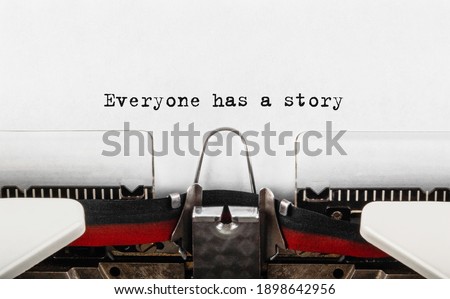 Text Everyone has a story typed on retro typewriter Royalty-Free Stock Photo #1898642956