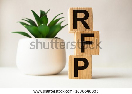 a word RFP on wooden cubes. business concept. business and Finance Royalty-Free Stock Photo #1898648383