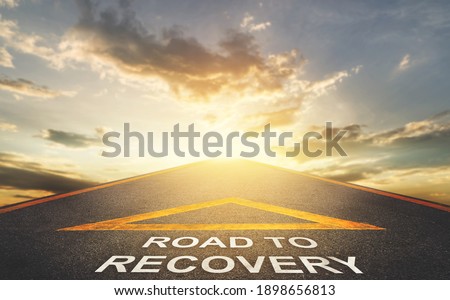 Road to recovery concept for business and health concept with golden sky background.