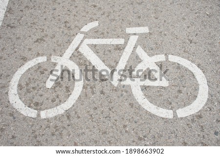 Bicycle lane sign on the road.