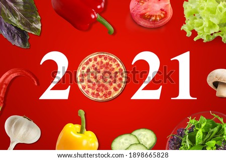 Happy New Year 2021 concept for restaurant or pizza brand with pizza and numbers.