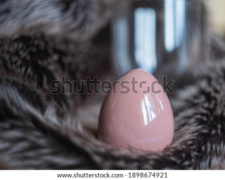 Easter background with Easter eggs. Soft focus, bokeh effect. Happy easter greeting card template in rose color. Top view with copy space. 