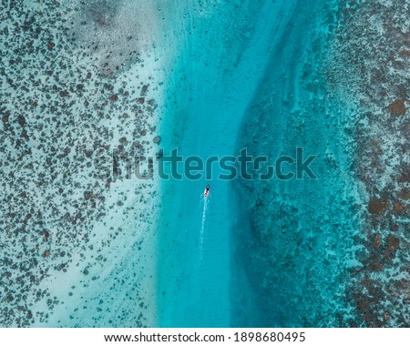 Aerial shots of the  Sea, Mountains, and Reefs in Mo'orea, French Polynesia  Royalty-Free Stock Photo #1898680495