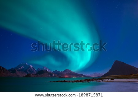 Shot from "Stor Sandnes" in Flakstad showing the northern lights on sky in Lofoten islands. "Aurora Borealis"