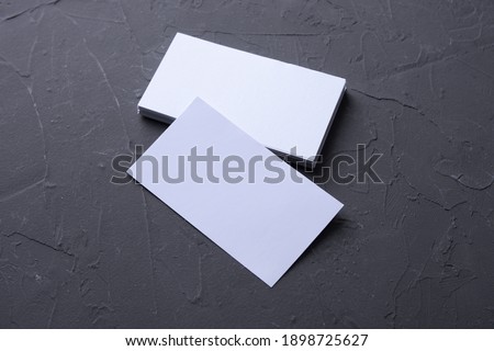 Business card blank on beton rock background. Corporate Stationery, Branding Mock up. Creative designer desk. Flat lay. Copy space for text. Template for ID.