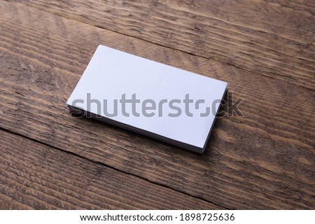 Business card blank on wooden background. Corporate Stationery, Branding Mock up. Creative designer desk. Flat lay. Copy space for text. Template for ID
