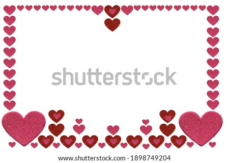 Red and pink glitter heart shapes in a frame, isolated on a white background with copy space