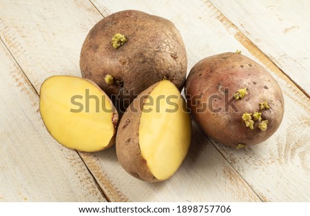 picture of potatoes on wooden board
