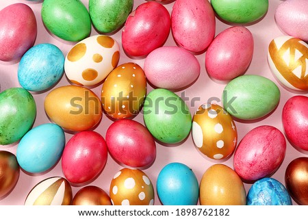 Happy Easter concept, spring greeting card, composition with gold and blue decorated eggs on a delicate background. Minimal holiday concept, space for text, banner for screen,