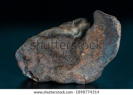 Chondrite Meteorite isolated, piece of rock formed as an asteroid in the universe at during Solar System creation. The meteorite comes from an asteroid fall impacting Earth at Atacama Desert
