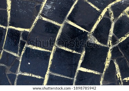 Black tiles on the wall