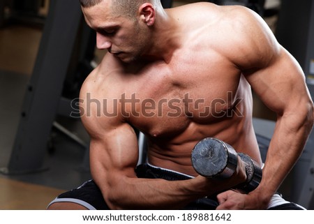 Man working out in a fitness club 