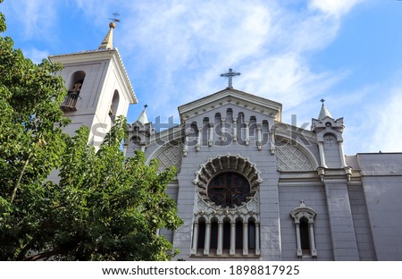 View of a Catholic church against the blue sky, in the center of Murcia.