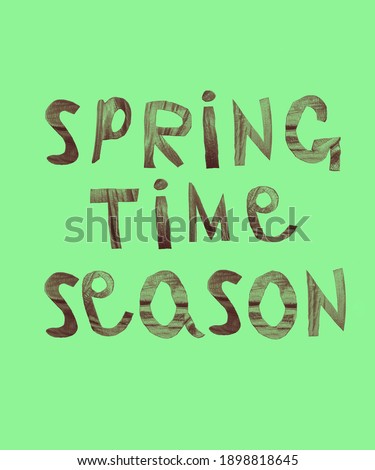 words spring time season made from young cutting leaves lie on green paper background. Green letters. Empty copy space for inscription or objects. Sign symbol concept of season in nature. springtime