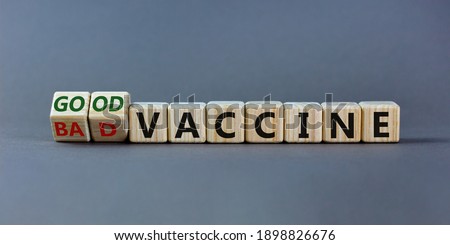 Good or bad vaccine symbol. Turned a cube and changed words 'bad vaccine' to 'good vaccine'. Beautiful grey background, copy space. Covid-19 and medical good vaccine concept.