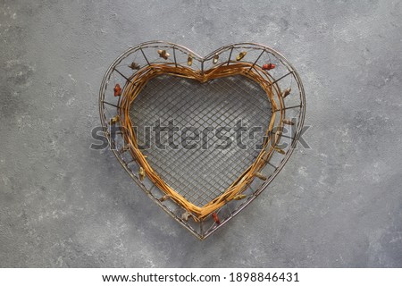 Heart shaped plate on a stone background