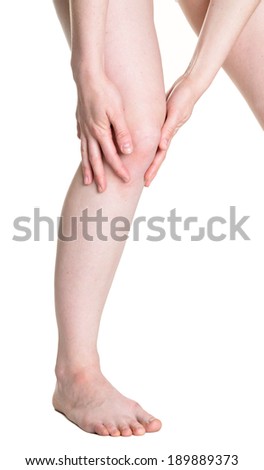 Acute pain in a woman knee. Female holding hand to spot of knee-aches. Concept photo with Color Enhanced blue skin with read spot indicating location of the pain. Isolation on a white background. 
