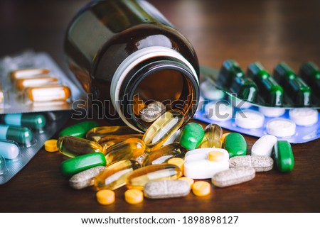 Drug prescription for treatment medication. Pharmaceutical medicament, cure in container for health. Pharmacy theme, capsule pills with medicine antibiotic in packages. Royalty-Free Stock Photo #1898898127