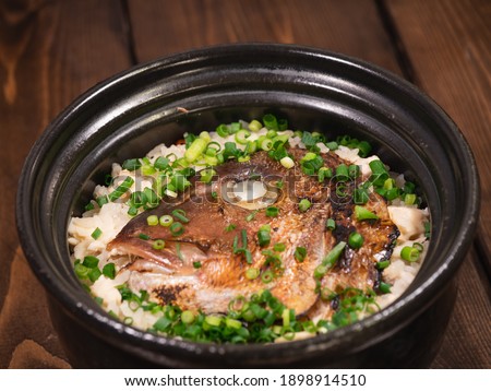 Japanese food "taimeshi". A dish of sea bream soup stock and meat cooked with rice.