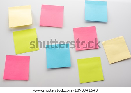 blank Sticker notes on the white background. Mockup sticky Note Paper. empty sheets for notes on a white bulletin board Royalty-Free Stock Photo #1898941543