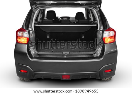 Clean, open empty trunk in the gray  car SUV on white isolated  background Royalty-Free Stock Photo #1898949655
