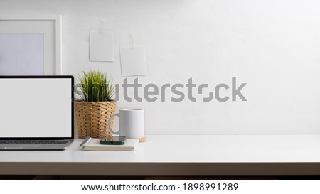 Close up view of workspace with laptop, stationery, decorations and copy space, clipping path